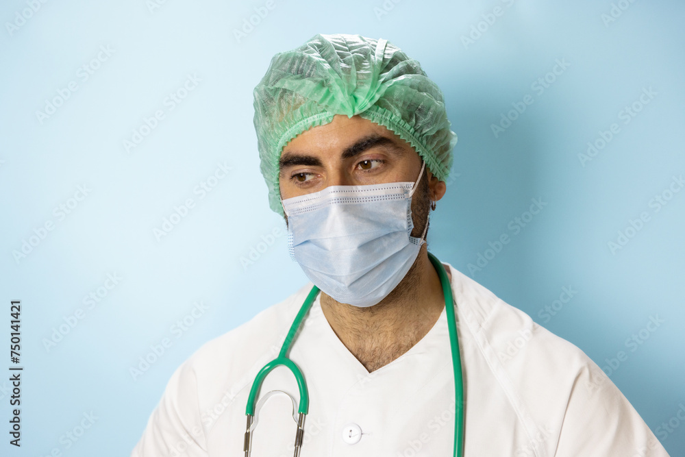 portrait of a nurse in white coat doctor with stethoscope turquoise blue background, with smiling face, making joke portrait of a nurse in white coat doctor with stethoscope turquoise blue background, with smiling face, making joke