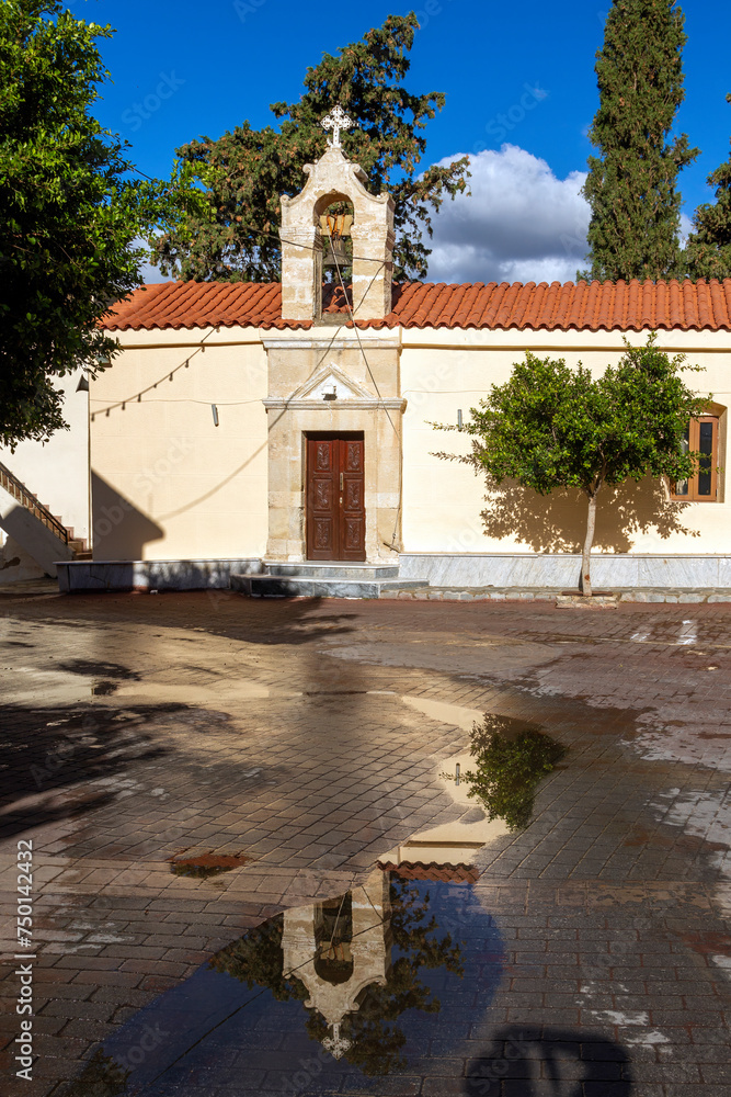 Obraz premium Traditional Greek orthodox church just after the rain, in a village in Rethimno region, Crete island, Greece, Europe. 