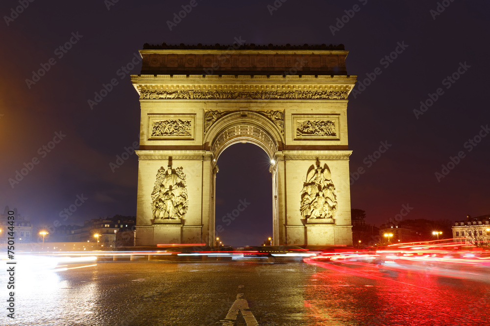 The Triumphal Arch in rainy evening, Paris, France.