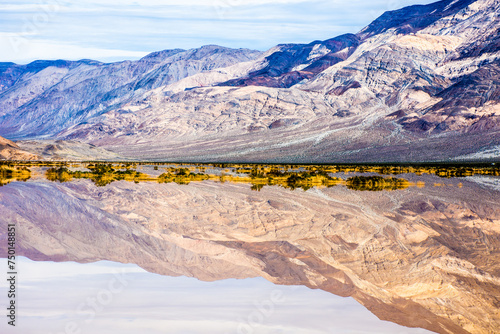 Flooded Death Valley National Park, California, on the Nadeau Trail with mountain reflections