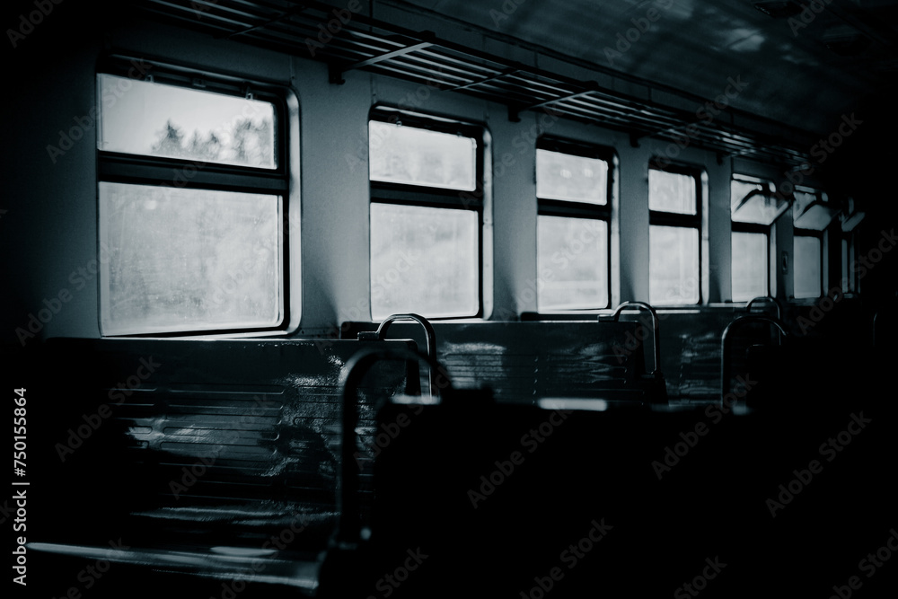 A black and white photograph of the interior of the train. Public transportation. Traveling and trips. A black and white photograph of the interior of the train. Public transportation. Traveling and trips.