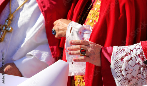 hand of a bishop in clerical dress blessing the faithful photo