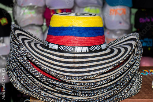 Sell of traditional hats from Colombia called sombrero vueltiao at the famous Comuna 13 in Medellin photo