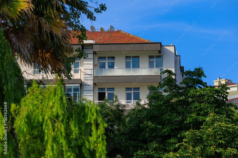 View of buildings and houses in public places in Turkey, sunny summer day