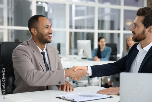 Wallpaper Mural Lawyer shaking hands with client in office, selective focus Torontodigital.ca