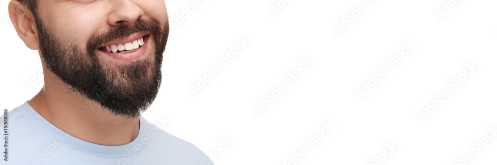Obraz premium Man with clean teeth smiling on white background, closeup. Banner design with space for text