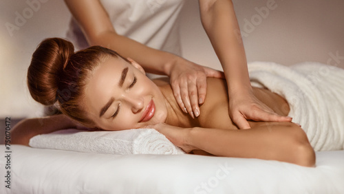 Body Care. Woman Enjoying Shoulder Massage With Closed Eyes