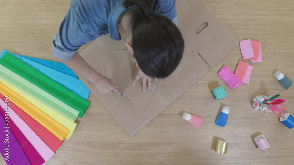 Art and craft woman doing cardboard eco-friendly project, top view Art and craft woman doing cardboard eco-friendly project, top view