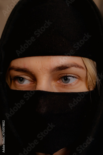 portrait of a woman in a hood