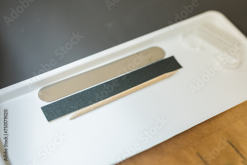 Nail file indoors background. Concept of polishing nails. Spa treatment beauty.