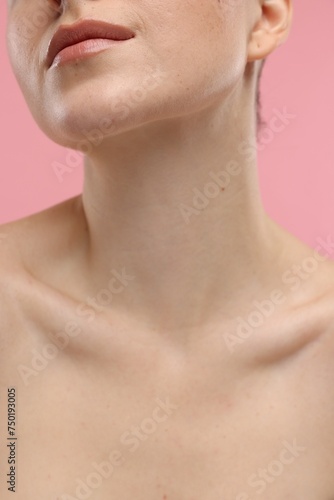 Beauty concept. Woman on pink background, closeup