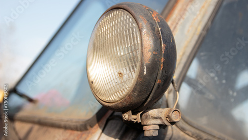 headlight of a retro car in a rusty condition