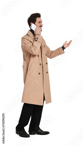 Handsome man talking on phone against white background