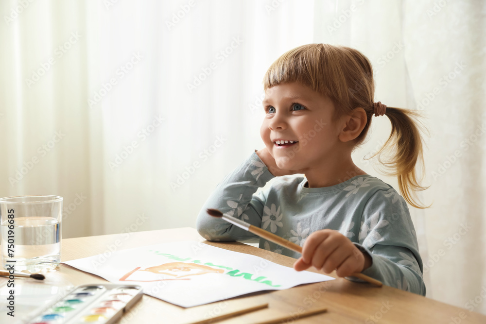 Cute little girl drawing at wooden table indoors. Child`s art Cute little girl drawing at wooden table indoors. Child`s art