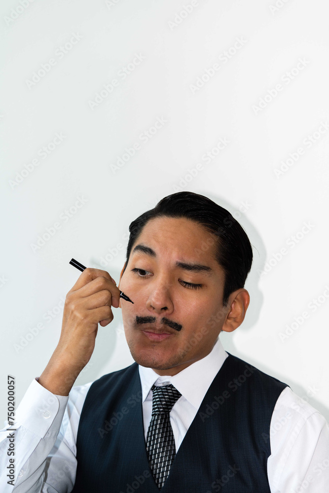 Eccentric Latin man drawing a mustache on his face
