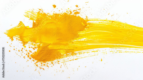A dynamic smear of yellow acrylic paint splattered on a white background creating a feeling of energy photo