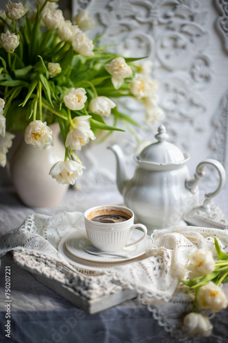 Beautiful still life with white tulips. Vintage style life. Coffee time.