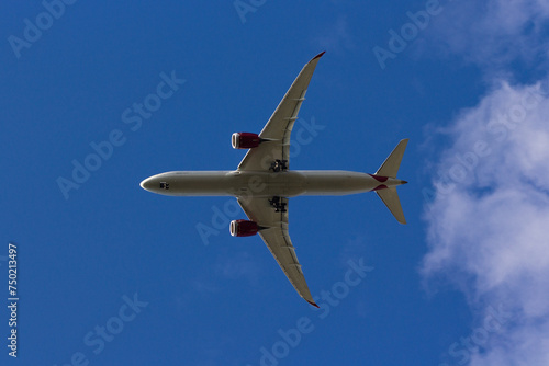 Airplane Soaring in a Blue Sky