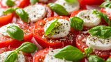 Caprese salad with fresh mozzarella, ripe tomatoes, and basil, top-down view isolated on white background. A simple yet elegant Italian dish concept for design and print