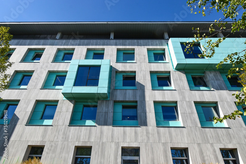 Facade of a blue windows building with sky