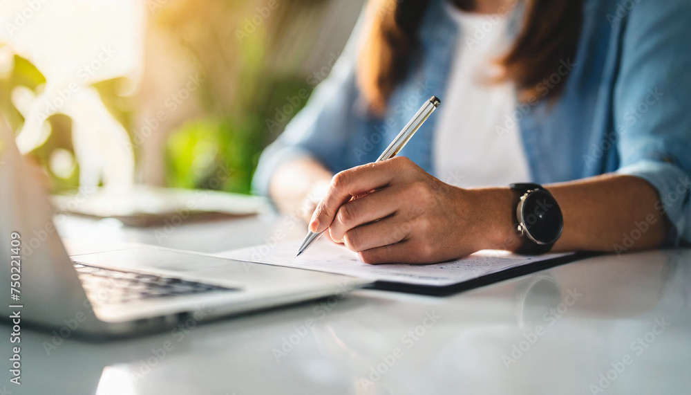 Woman's hand signing contract with agent at white table, symbolizing trust and commitment in insurance and real estate deals Woman's hand signing contract with agent at white table, symbolizing trust and commitment in insurance and real estate deals