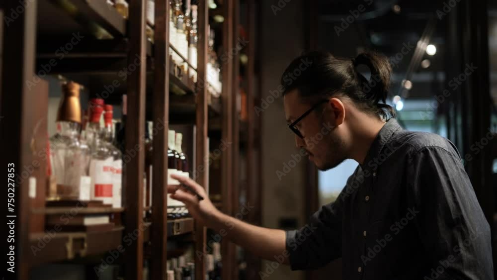 Night club concept of 4k Resolution. The bartender is checking the merchandise in the store. A group of specialized clubs that sell alcoholic beverages. Night club concept of 4k Resolution. The bartender is checking the merchandise in the store. A group of specialized clubs that sell alcoholic beverages.