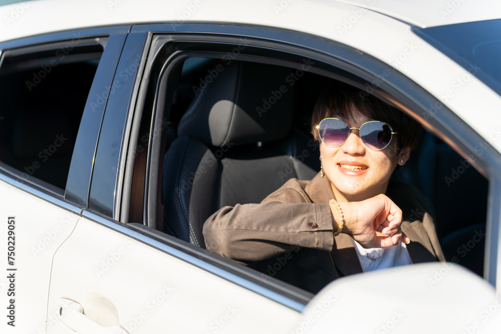 Group of Happy Asian man enjoy and fun outdoor lifestyle road trip travel nature countryside on summer holiday vacation. Generation z guy sitting in the car looking beautiful nature out of the window.