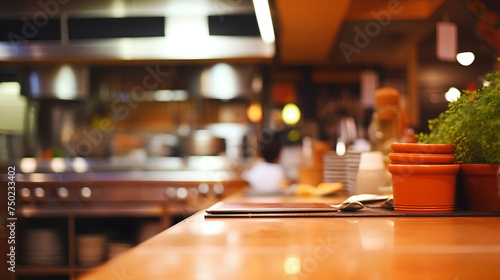 Blurred image of a restaurant kitchen with a warm  inviting glow