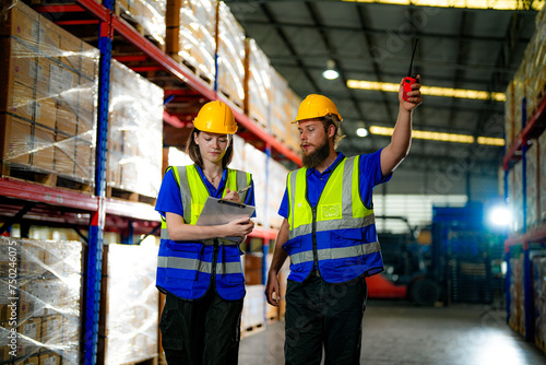 operation workers checking and inspecting cargo for stack items for shipping. males worker checking the store factory. industry factory warehouse. Worker Scanning Package In Warehouse. © ultramansk