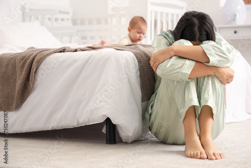 Young woman with her baby s...