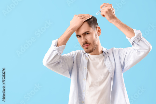 Young brunette man giving h...