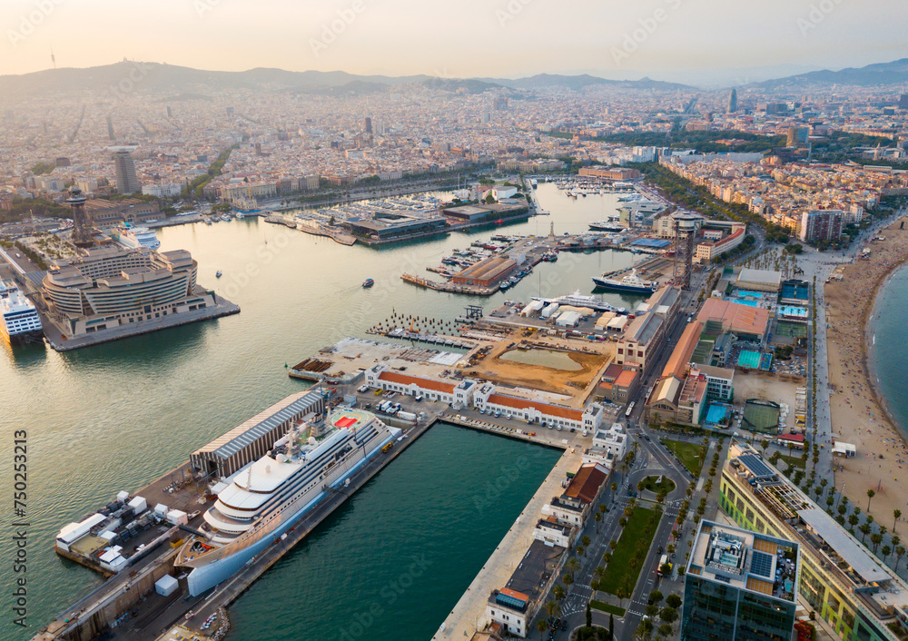 Image of aerial view from drones of old port in Barcelona with of sailboats and yachts