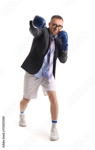 Funny businessman in suit and sportswear with boxing gloves isolated on white background