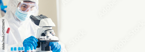 Banner Scientist man look Microscope research in science laboratory. Banner Asian scientist use microbiology microscope in laboratory equipment chemistry lab. Biochemistry experiment with copy space