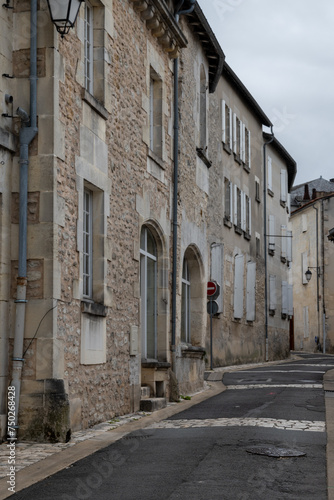 Fototapeta Naklejka Na Ścianę i Meble -  View on old streets and houses in Cognac white wine region, Charente, walking in town Cognac with strong spirits distillation industry, France
