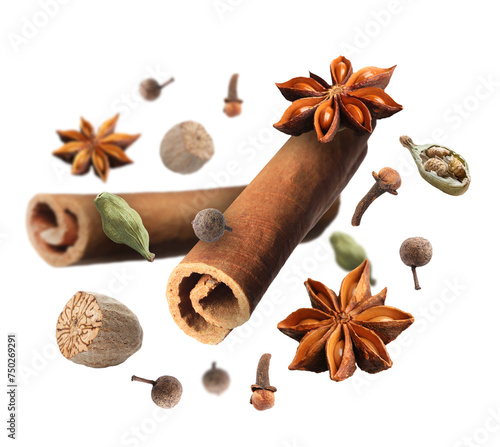 Cinnamon sticks and other aromatic spices falling on white background