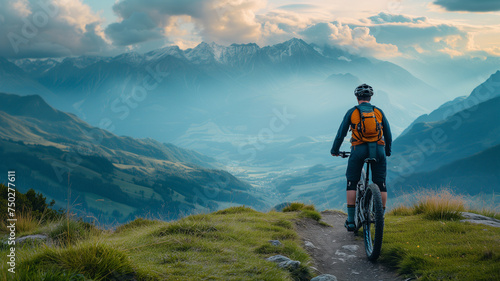 A biker, attired in specialized cycling gear, taking a moment to absorb the panoramic view of mountains 