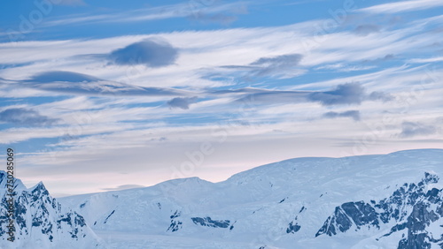 Antarctic glacial iceberg mountain aerial. Wild nature view of snow mounts at South Polar landscape. Majestic winter at harsh snowy land. Antarctica continent at climate change scene © mozgova