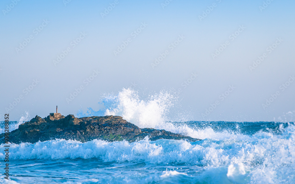 closeup view of waves crashing on the rocks in Pohang beach, South Korea. 