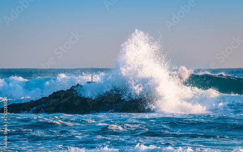 closeup view of waves crashing on the rocks in Pohang beach, South Korea. 