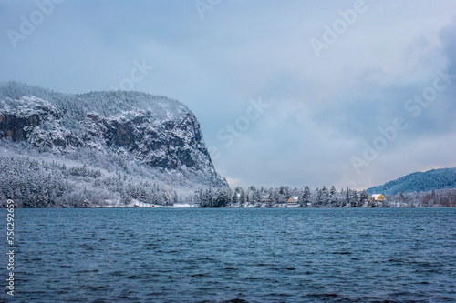 Scenic view of Mount Kineo across Moosehead Lake, as seen from Rockwood Town Landing. A snow covered landscape after a winter storm. Maine, USA photo