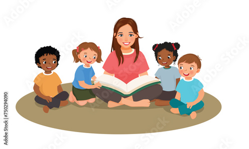 Young female teacher explaining lesson telling story book to students sitting on the floor