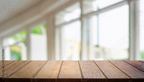 Wooden board empty table in front of blurred background. Perspective white house and window - can be used for display or montage your products. Mock-up for display of product. © Uuganbayar