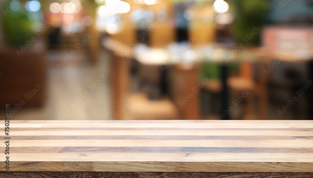 Empty wooden table in front of abstract blurred background of coffee shop. can be used for display or montage your products. Mock-up for display of product