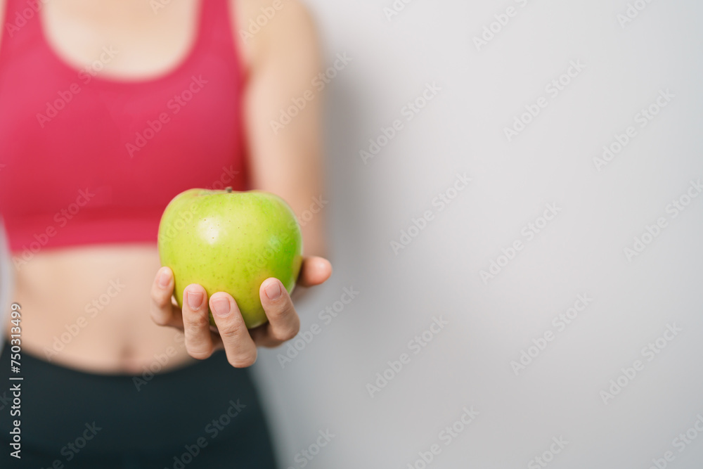 woman hand hold green Apple, happy female fitness choose fruit is Healthy food. Dieting control, Weight loss, Obesity, eating lifestyle and nutrition concepts woman hand hold green Apple, happy female fitness choose fruit is Healthy food. Dieting control, Weight loss, Obesity, eating lifestyle and nutrition concepts