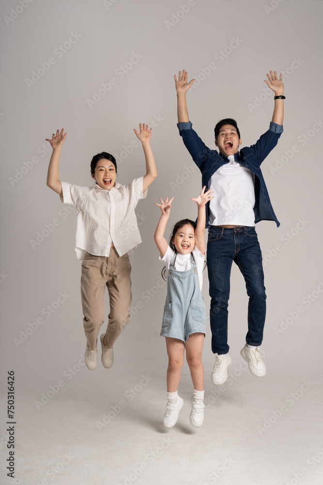 Asian family portrait posing on white background Asian family portrait posing on white background
