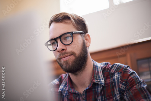 Man, laptop and glasses for internet, freelancer and online or email for communication. Male person, remote work and notification in home office, reflection and browse for research on app and website