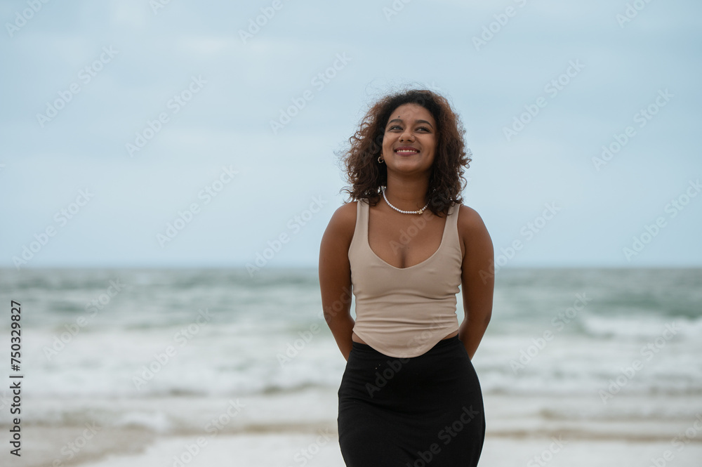 Young woman seen by the beach