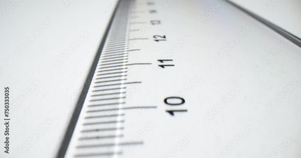 Plastic transparent ruler on white paper Plastic transparent ruler on white paper
