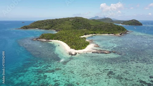 Aerial view of Drawaqa island, crystal clear waters of Pacific Ocean, seascape with colorful coral reefs, many shades of turquoise and blue - landscape panorama of Yasawa islands from above, Fiji photo